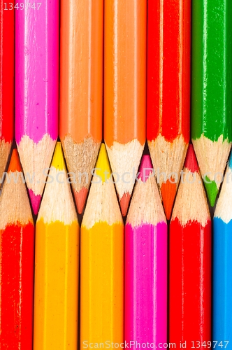 Image of Texture of colorful pencils lined up in a row