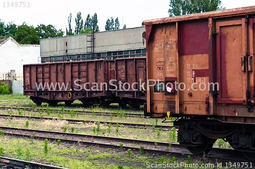 Image of Old trains in a trainyard 