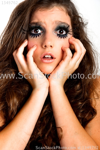 Image of Terrified young girl with extreme makeup