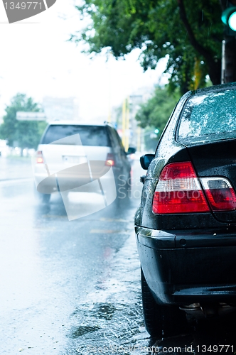 Image of Close up of a car in the rain with blurry background