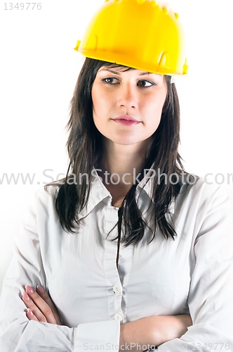 Image of Portrait of a young engineer woman in yellow helmet