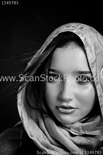 Image of Closeup of a beautiful girl in scarf in black and white