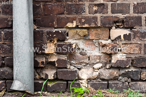 Image of Brick wall with pipe