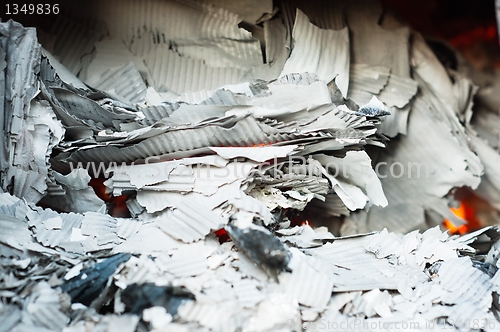 Image of Papers burning in recycle center