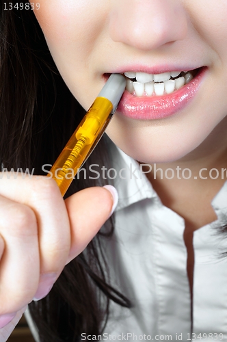 Image of Woman Chewing on a Pencil