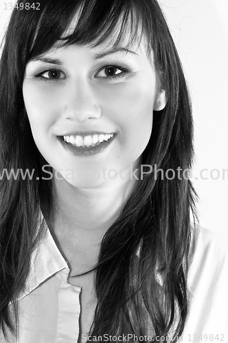 Image of Closeup portrait of cute young girl smiling against white backgr