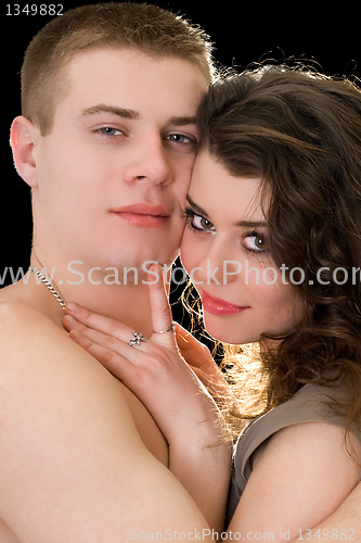 Image of Portrait of the beautiful young couple. Isolated on black