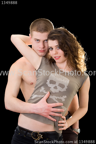 Image of Beautiful loving young couple. Isolated on black