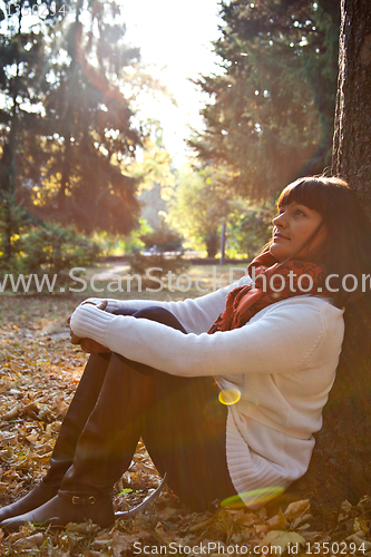 Image of woman in the autumn park 