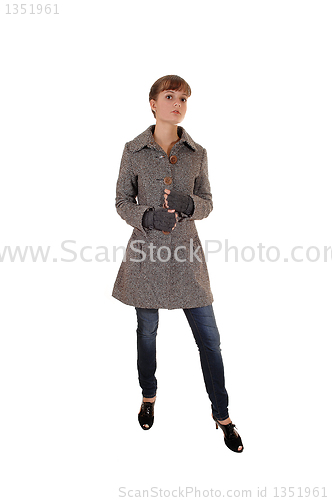 Image of Girl in brown coat.