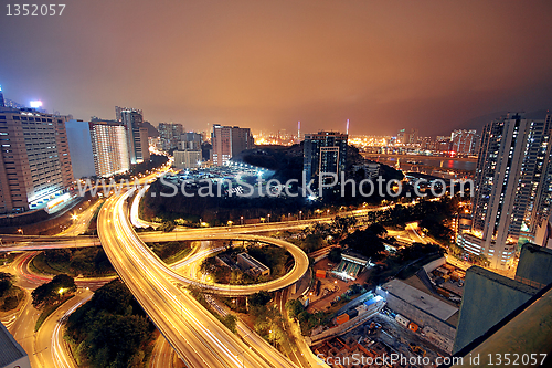 Image of Freeway in night with cars light in modern city. 