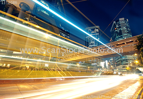 Image of speeding car through the street