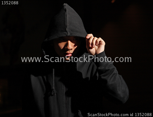 Image of Monochrome picture of a guy in a hood 