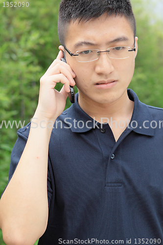 Image of chinese man talking phone and worry