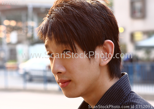 Image of asia man relax in the park in the city 