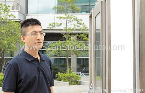 Image of man seeing the advertising board