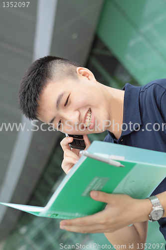 Image of Portrait of businessman calling by phone 