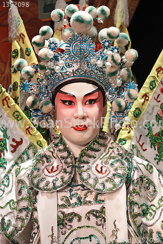 Image of chinese opera dummy and red cloth as text space ,it is a toy,not