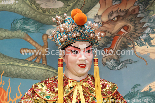 Image of chinese opera dummy and red cloth as text space ,it is a toy,not