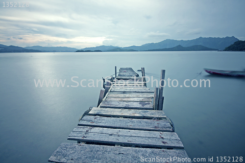 Image of old jetty walkway pier the the lake 