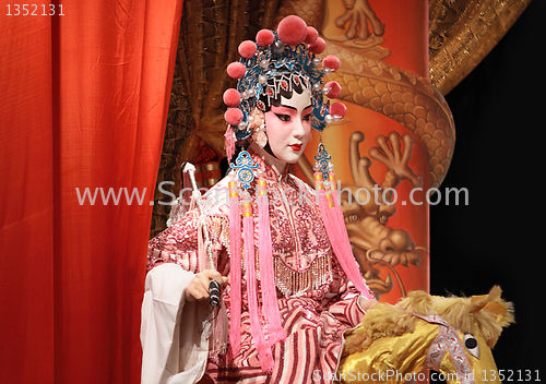 Image of chinese opera dummy and red cloth as text space ,it is a toy,not