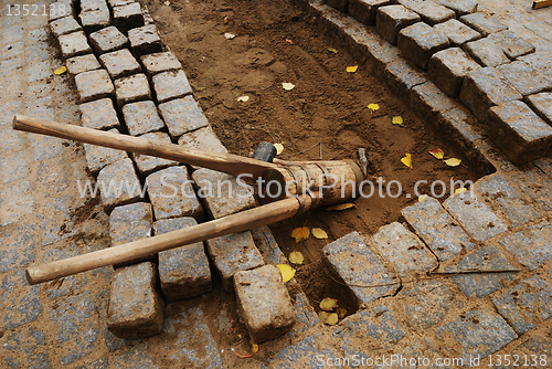 Image of stones and tools for paving