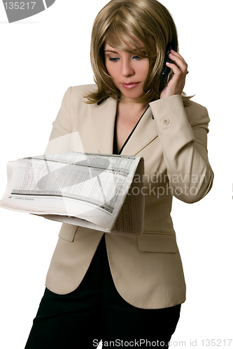 Image of Businesswoman reading Financial news