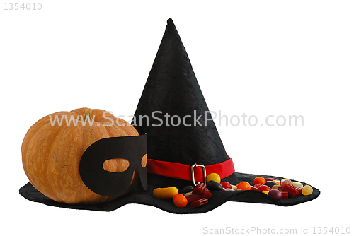 Image of Halloween candies and masqueraded pumpkin isolated