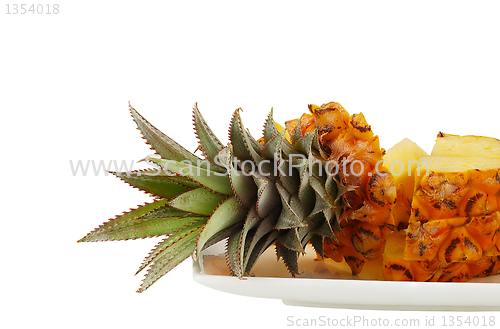 Image of Sliced pineapple on white plate