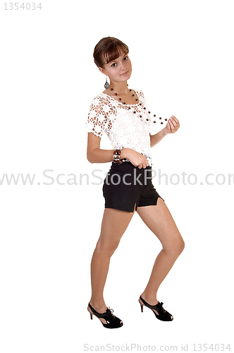 Image of Girl in shorts and blouse.