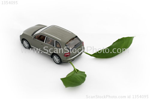 Image of Green leaves and a car.Ecology conception