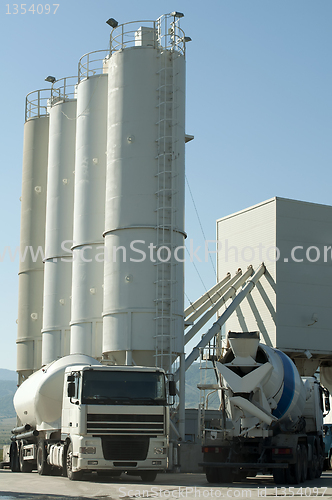 Image of Cement factory and a truck loading cement