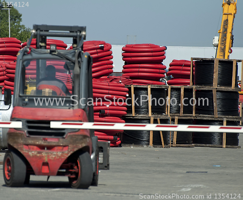 Image of Large rolls of black and red cables