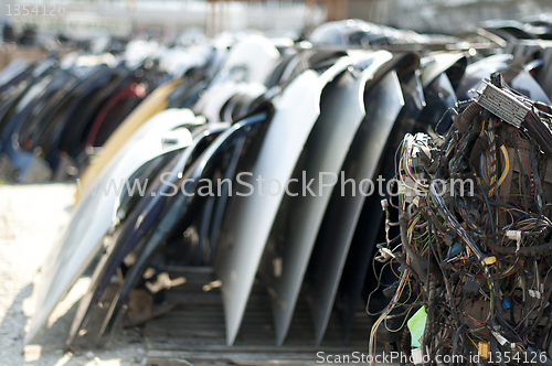 Image of Old car parts and cables in automorgue