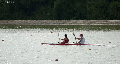 Image of Rowers in a boat in line