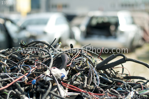 Image of Old car parts and cables in automorgue