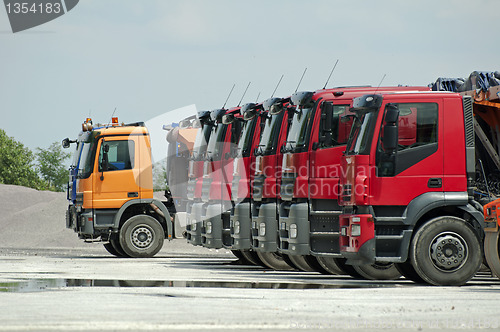 Image of Trucks, rollers and machinery for asphalting