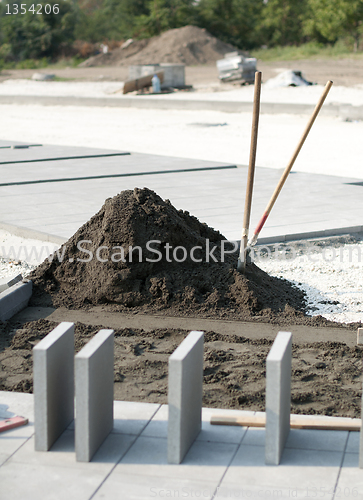 Image of Tiling of pavement and sand pile