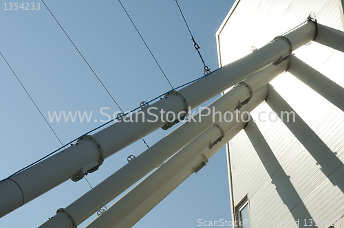 Image of Industrial tubes connected to building for mixing concrete