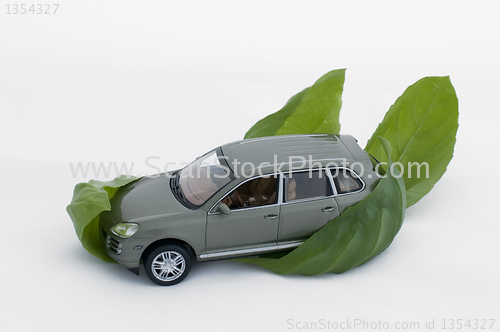 Image of Green leaves and a car.Ecology conception