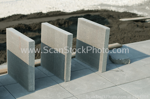 Image of Tiling of pavement and sand pile