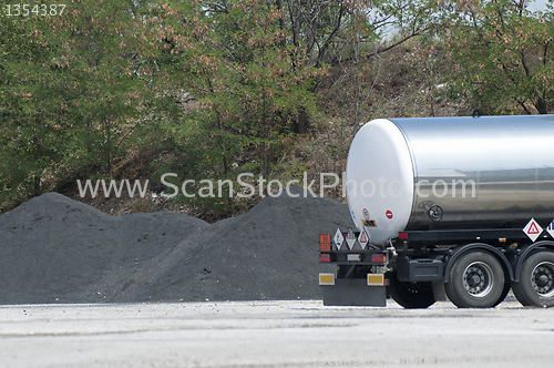 Image of Piles of asphalt and track