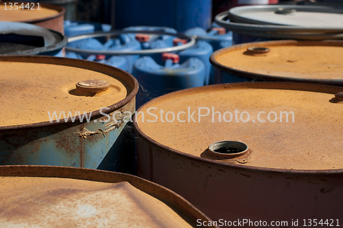 Image of Old colored barrels for oil products