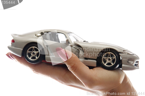 Image of Car toy on palm