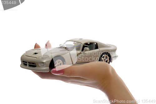 Image of Car toy on palm