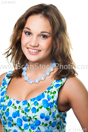 Image of beautiful girl in wearing cute dress with blue cherries