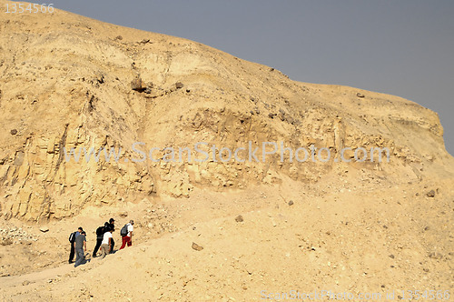Image of walkers in a desert