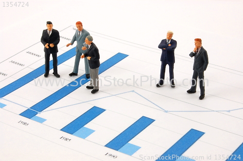 Image of business man over economic chart