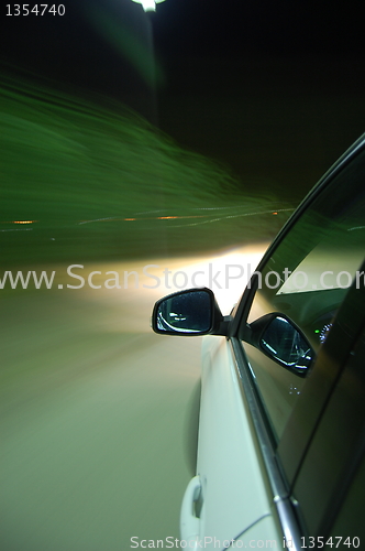 Image of night drive with car in motion 