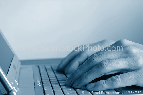 Image of typing hands on keyboard